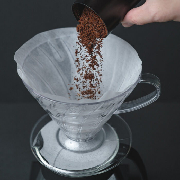 The Hario V60 Coffee Dripper is a classic and affordable option for coffee enthusiasts. Made from high-quality transparent plastic, this dripper offers excellent thermal stability compared to its ceramic or metal counterparts. The clear plastic material is lightweight yet durable, making it perfect for everyday use. To ensure optimal brewing results, we recommend pre-heating your brewing equipment before brewing. Simply pour some hot water onto your brewing setup before adding your coffee grinds. This not only preheats your brewing setup but also washes out the paper filter to ensure there's no paper taste in your brew. In the box, you'll find the Hario V60 Dripper in your choice of Clear Plastic '01' or '02', along with a Hario coffee scoop. With its sleek design and superior performance, the Hario V60 Coffee Dripper is the perfect addition to any coffee lover's collection. Upgrade your coffee brewing experience with the Hario V60 Coffee Dripper - lightweight, durable, and affordably priced. Included in the box is: 1x Hario V60 Dripper - Clear Plastic '01' or '02' 1x Hario coffee scoop