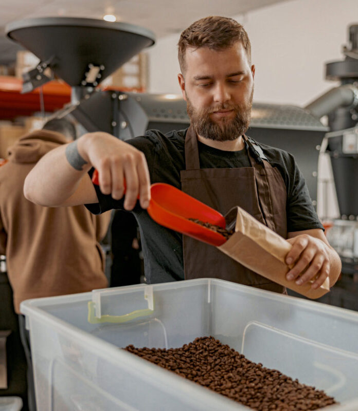 Barista Packs Roasted Coffee Beans Into Packages F 2022 09 28 23 53 58 Utc Scaled E1679027429791