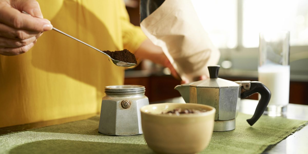 Woman Making Coffee With Moka Pot